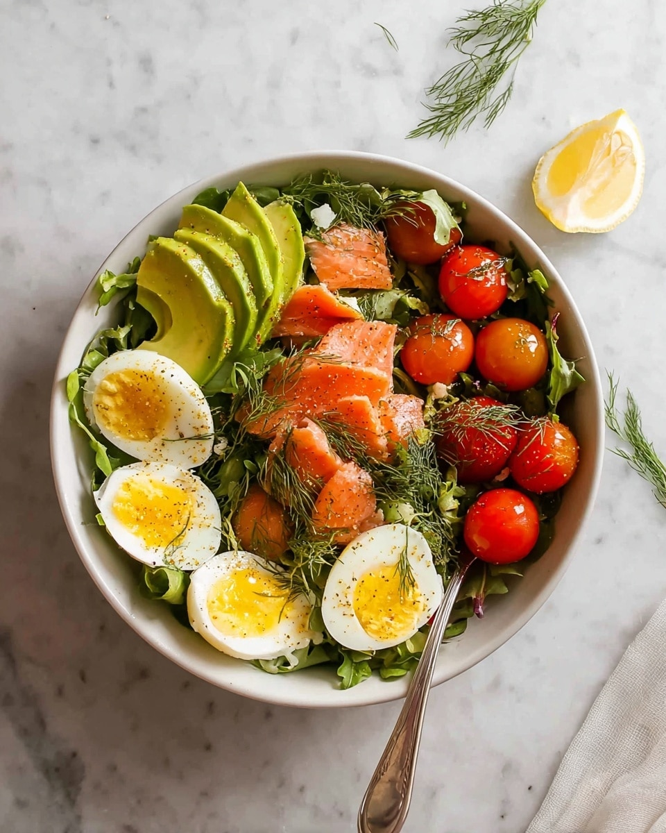 A white bowl filled with a fresh salad on a white marbled texture, the bottom layer is green leafy arugula. On top, on the left side, there are thin slices of avocado, bright green and smooth. Around the bowl, there are smoked salmon pieces with an orange-pink hue. There are four halved soft-boiled eggs with slightly runny yellow yolks and white edges scattered evenly around the bowl. Bright red cherry tomatoes on the vine sit in the center. A lemon wedge is placed on the right side, and fresh green dill sprigs are sprinkled throughout. A silver fork rests inside the bowl on the right side. Photo taken with an iphone --ar 4:5 --v 7