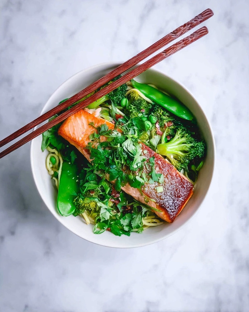 A white bowl sits on a white marbled surface filled with a vibrant dish starting with a bottom layer of tender green vegetables, including broccoli and snap peas, with some noodles peeking through. On top of this fresh green base lies a perfectly cooked piece of salmon, its skin side crisp and golden brown, while the flesh shows a soft pink hue. The dish is garnished generously with fresh green herbs scattered across the top. Two wooden chopsticks rest diagonally on the edge of the bowl, adding a rustic touch to the presentation. photo taken with an iphone --ar 4:5 --v 7