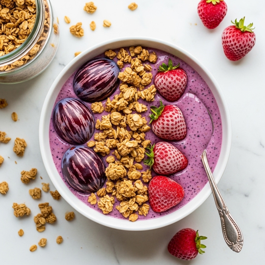 A white bowl filled with three main layers: the bottom layer is a smooth purple yogurt, partially visible and forming a creamy base; on top of the yogurt lies a golden brown granola mix with oats, nuts, and seeds spread unevenly; the upper layer features four bright red frozen strawberries and two dark purple plums sliced thinly with each slice still connected, placed side by side for contrast. The bowl sits on a white marbled surface scattered with extra granola pieces, whole frozen strawberries nearby, and a glass jar of granola tipped on its side with its contents spilling out. A silver spoon with a detailed handle rests inside the bowl. Photo taken with an iphone --ar 4:5 --v 7