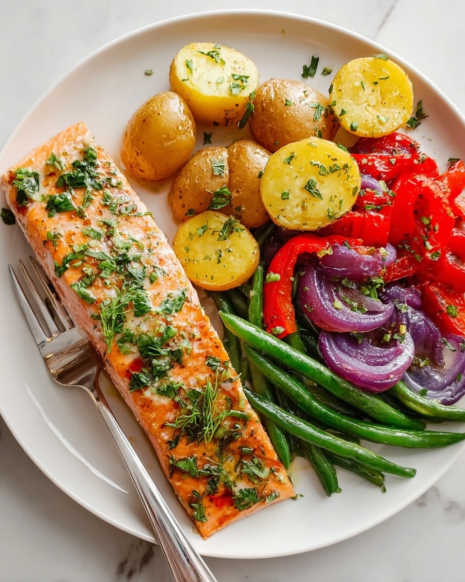 A white plate on a white marbled surface holds a meal with four sections: a large, rectangular piece of grilled salmon at the front left, its pink flesh topped with green herbs and small bits of garlic; behind it, halved golden-brown roasted potatoes seasoned with herbs; to the right, a mix of bright red roasted bell pepper strips and whole green beans; and purple roasted onion halves scattered amongst the vegetables. A silver fork lies at the bottom left edge of the plate. The colors are vibrant and the textures show grilling marks and fresh herbs. photo taken with an iphone --ar 4:5 --v 7